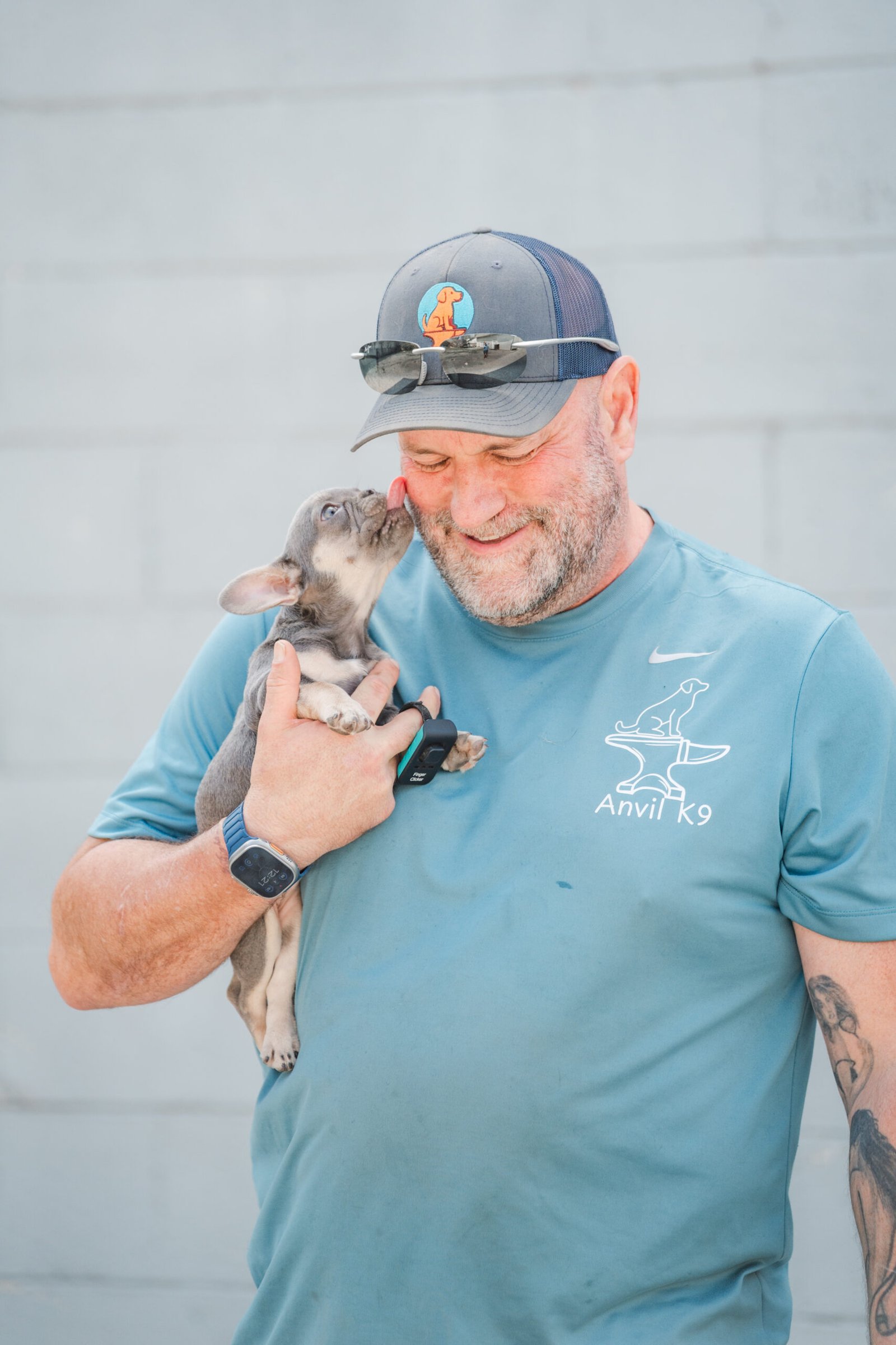 Jake Mumford, owner of Anvil K9 Dog Training in Chattanooga, with a Frenchie puppy